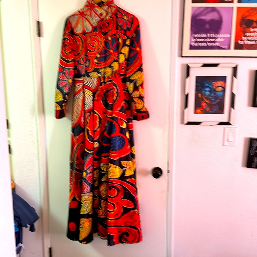 Formal maxi dress with tight bodice and full skirt.